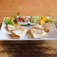 Quesadilla · Shredded chicken and melted cheese with 2 soft flour tortillas.