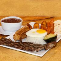 Bandeja Paisa Acento · Traditional country platter with beef, rice, beans, pork skin, sausage, sweet plantain, egg,...