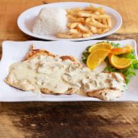 Pechuga con Champinones · Grilled chicken breast topped with mushroom sauce. Served with salad, rice and fries.