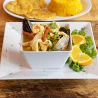 Mariscada Acento · Mixed seafood soup served with yellow rice and tostones.