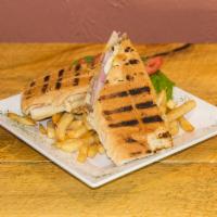 El Cubano · Authentic Cuban sandwich served with fries.