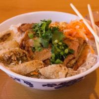 102. Vermicelli with Grilled Pork and Egg Roll · Traditional Vietnamese rice noodle bowl.
