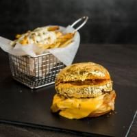 Gold Burger · 8 oz beef patty covered with 24K GOLD LEAVES, Caramelized Onions, Velvetta Cheese, Brioche B...
