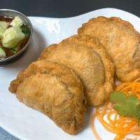 Curry Puff · 3 pieces. Puff pastry stuffed with chopped chicken, potatoes, onions, curry powder and serve...