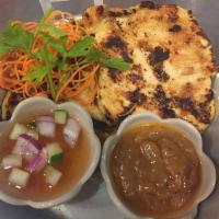 Chicken Satay · 4 pieces. Marinated grilled chicken breast with a side of homemade peanut sauce and cucumber...