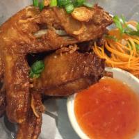 Tasty Chicken Wings · Marinated chicken wings with Thai herbs and soy sauce served with sweet chili sauce dipping.