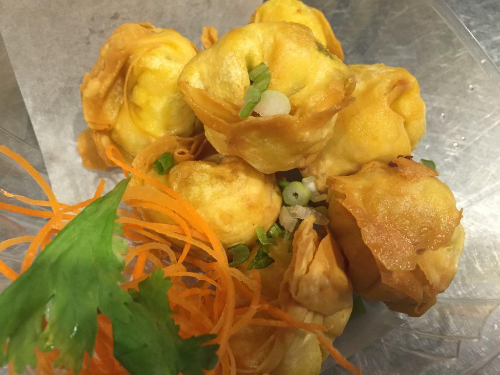 Crab Rangoon · 7 pieces. Imitation crab sticks, scallions, carrot, onions and cream cheese served with sweet chili sauce.