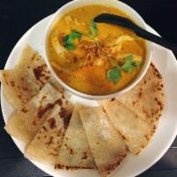 Mr. Roti · Roti bread with a side of coconut chicken curry.