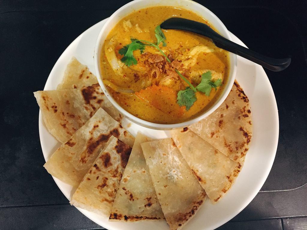 Mr. Roti · Roti bread with a side of coconut chicken curry.