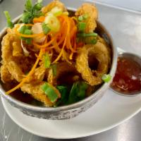 Golden Calamari · Crispy calamari served with sweet chili dipping sauce. Contains egg and flour.