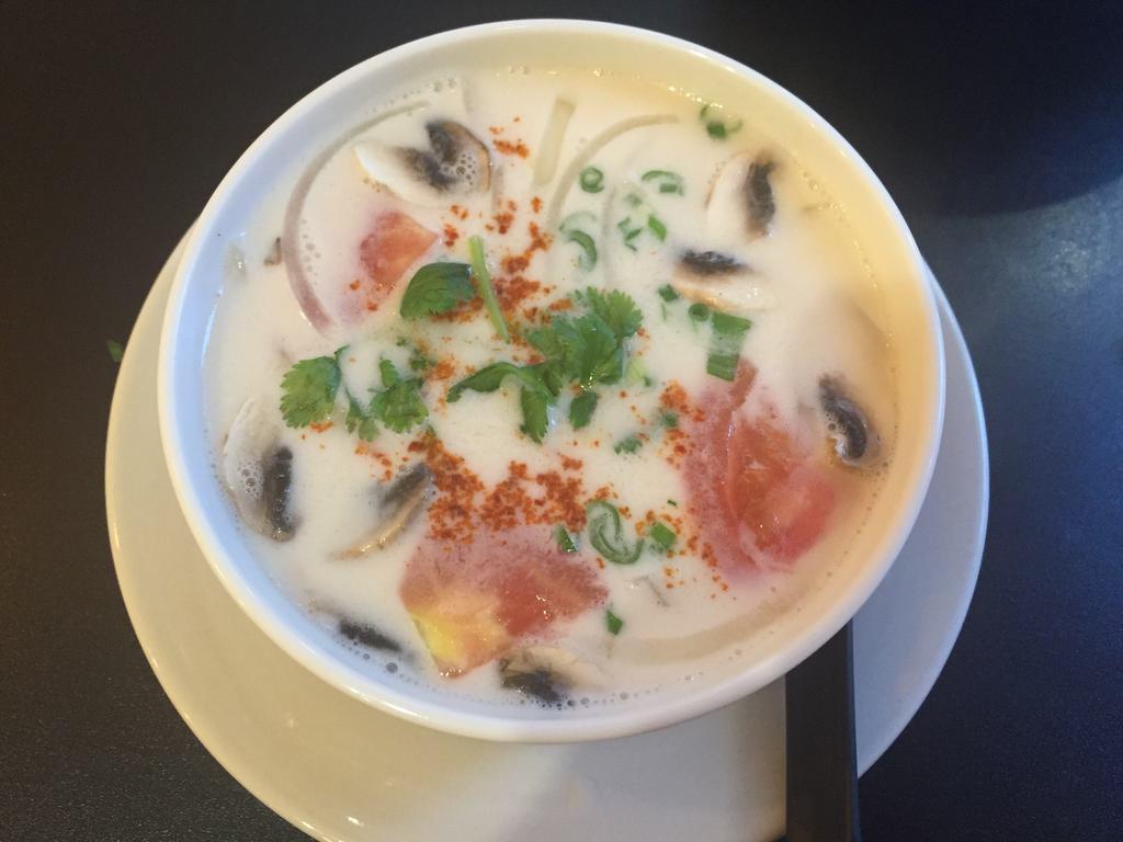 Tom Kha Coconut Chicken · Homemade coconut broth with chicken, mushrooms, tomatoes and onions.—- Contain with shellfish 
