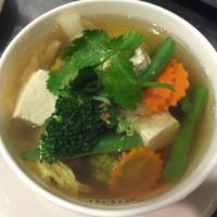 House Vegetable Soup · Refreshing clear chicken broth soup with mixed vegetables and tofu. Contains soy sauce.