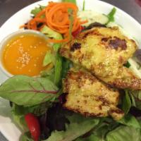 Garden Salad · Fresh mixed green vegetables, tomatoes, fried tofu and cucumber with our homemade peanut dre...
