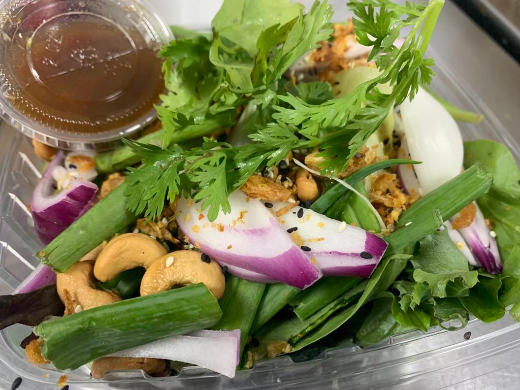 Healthy House Salad · Fresh mixed green vegetables, lettuce, peanuts, cashew nuts, sesames seeds, red onions, scallions, fried garlic and fried shallots with garlic lime juice. Vegan and vegetarian. ( Dressing is on the side) 