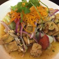 Mushroom and Tofu Salad · Crispy tofu and mushrooms, chili paste, lettuce, red onions, tomatoes, scallions and shrimp ...