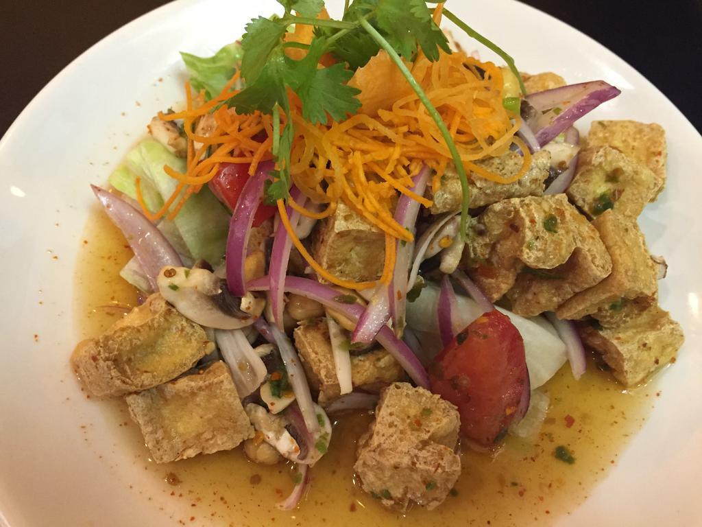 Mushroom and Tofu Salad · Crispy tofu and mushrooms, chili paste, lettuce, red onions, tomatoes, scallions and shrimp chili paste with lime juice. Spicy. ( dressing can not do on the side) 