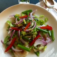 Yum Herbal Fish Salad · Fillet tilapia with lemongrass, red onions, scallions, peanuts and lime dressing. Gluten fre...