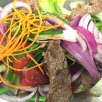 Beef Salad · Sliced grilled beef with red onions, scallions, chili and spicy lime dressing. Gluten free a...