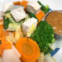 Steamed Vegetables and Tofu · Steamed mixed vegetables and steamed tofu with our homemade peanut sauce. Vegan and gluten f...