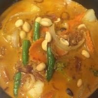 Massaman Curry ( Gluten free/ Vegan)  · Mild curry with coconut milk, potatoes, onions, carrots and roasted peanuts.