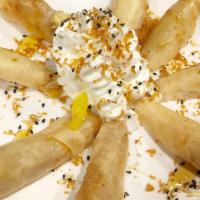 Dessert of the Month ( Fried Banana)  · Homemade crispy banana rolls with jackfruit and cheese serves with honey, toasted coconut an...