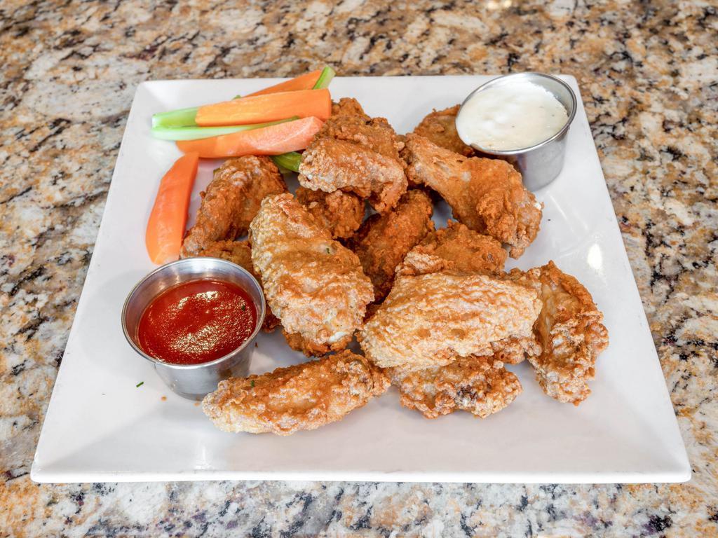 Buffalo Wings · Served with bleu cheese dip, celery, and carrots.
