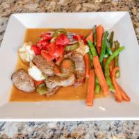 Chicken Scarpariello · Morsels of boneless chicken breast sauteed with Italian sausage, hot cherry peppers in a tan...