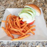 Veggie Burger · House-made vegetarian delight recipe, fresh avocado, heirloom tomato and sweet potato fries....