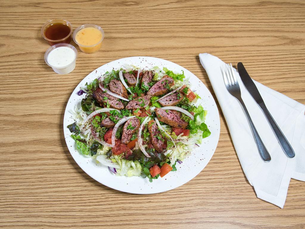 Beef Kebob with Green Salad Plate · Fresh salad with a variety of green vegetables typically served on a bed of lettuce. 