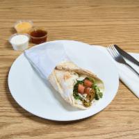 Falafel Sandwich · Stuffed in pocket bread and topped with lettuce, tomatoes and tahini sauce.