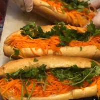 Banh Mi Baguette · marinated in sweet chili and soy:
 all sandwiches come with pickled daikon carrots , cucumbe...