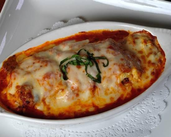 Lasagna · Layered pasta, our homemade meat sauce and ricotta cheese covered with melted mozzarella cheese and marinara sauce.