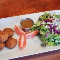 Falafel Salad · Falafels served with fresh lettuce topped with tomatoes, onions and feta cheese.