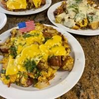 Farmer's Breakfast · 3 eggs scrambled mixed with home fries, onion, green pepper, bacon and cheese. Served with t...
