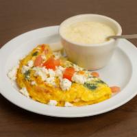 The Greek Omelette · Tomato, spinach, and Feta cheese.