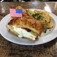 Original Croissant Sandwich · 2 eggs any style, Choice of Applewood bacon, sausage, or ham, choice of cheese. Served with ...