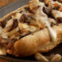 Philly Cheese Steak · Grilled onions, green peppers and mushrooms, and Provolone cheese.