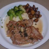 Vitello Piccata with Salad · Veal sauteed with capers and chopped onions in a white wine and lemon sauce. Served with you...