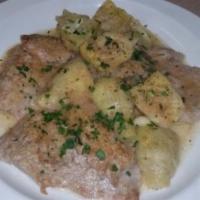Vitello alla Romana · Veal sauteed with artichokes and areganate in a white wine sauce. Served with potatoes and v...