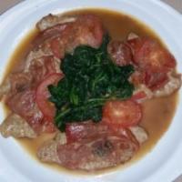 Vitello Saltimbocca · Veal topped with prosciutto, sage, slices of tomatoes and spinach in a Marsala wine sauce. S...