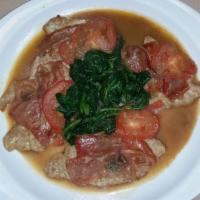 Vitello Saltimbocca with Salad · Veal topped with prosciutto, sage, slices of tomatoes and spinach in a Marsala wine sauce. S...