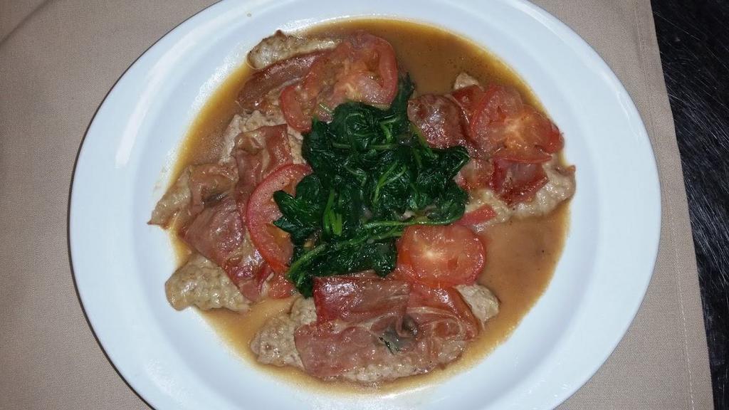 Vitello Saltimbocca with Salad · Veal topped with prosciutto, sage, slices of tomatoes and spinach in a Marsala wine sauce. Served with your choice of salad.