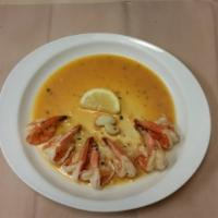 Shrimp Scampi · Broiled shrimps in a white wine lemon garlic sauce. Served with potatoes and vegetables.