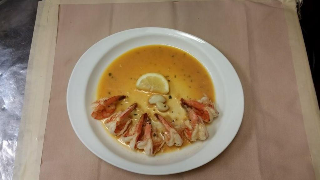 Shrimp Scampi with Salad · Broiled shrimps in a white wine lemon garlic sauce. Served with your choice of salad.