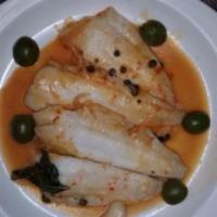 Filetto di Sogliola Livornese · Filet of sole sauteed with onions, capers, green olives, white wine and touch of marinara sa...