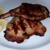 Grill Pork Chop · Served with potatoes and vegetables.