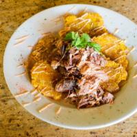 Rican Nachos · Fried crispy Tostones loaded with your choice of protein topped with our pink house sauce an...