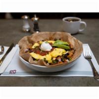 Grande Huevos Rancheros Dish · Potatoes, chipotle peppers, chicken chorizo, black beans, cheddar jack in a wheat tortilla. ...