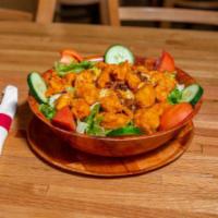 Buffalo Chicken Salad · Lightly breaded chicken, fried and tossed in any of our signature sauces, on crisp greens, t...