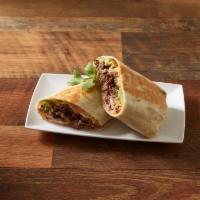 Mucho Mas Steak Burrito · Authentic burrito with steak in a freshly made flour tortilla, grilled crispy. Served with b...
